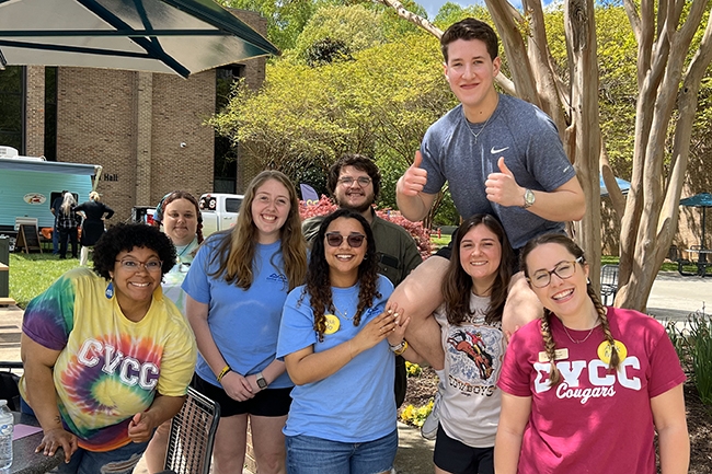 Group of students and staff in the quad area